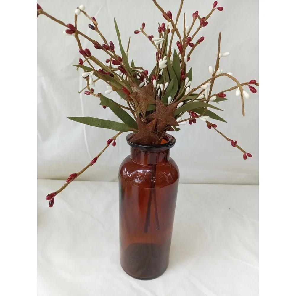 Amber apothecary bottle with red white pip berry pic w rusty stars